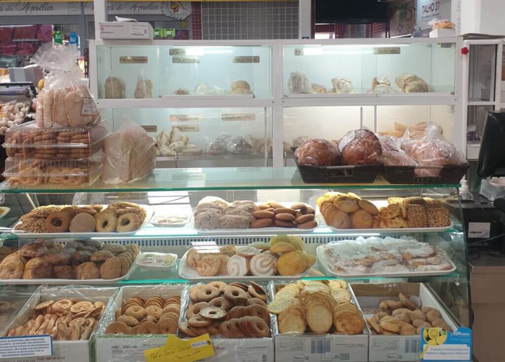 A tiered glass cabinet displays sugar-swirled and plain biscuits, divided by the box.